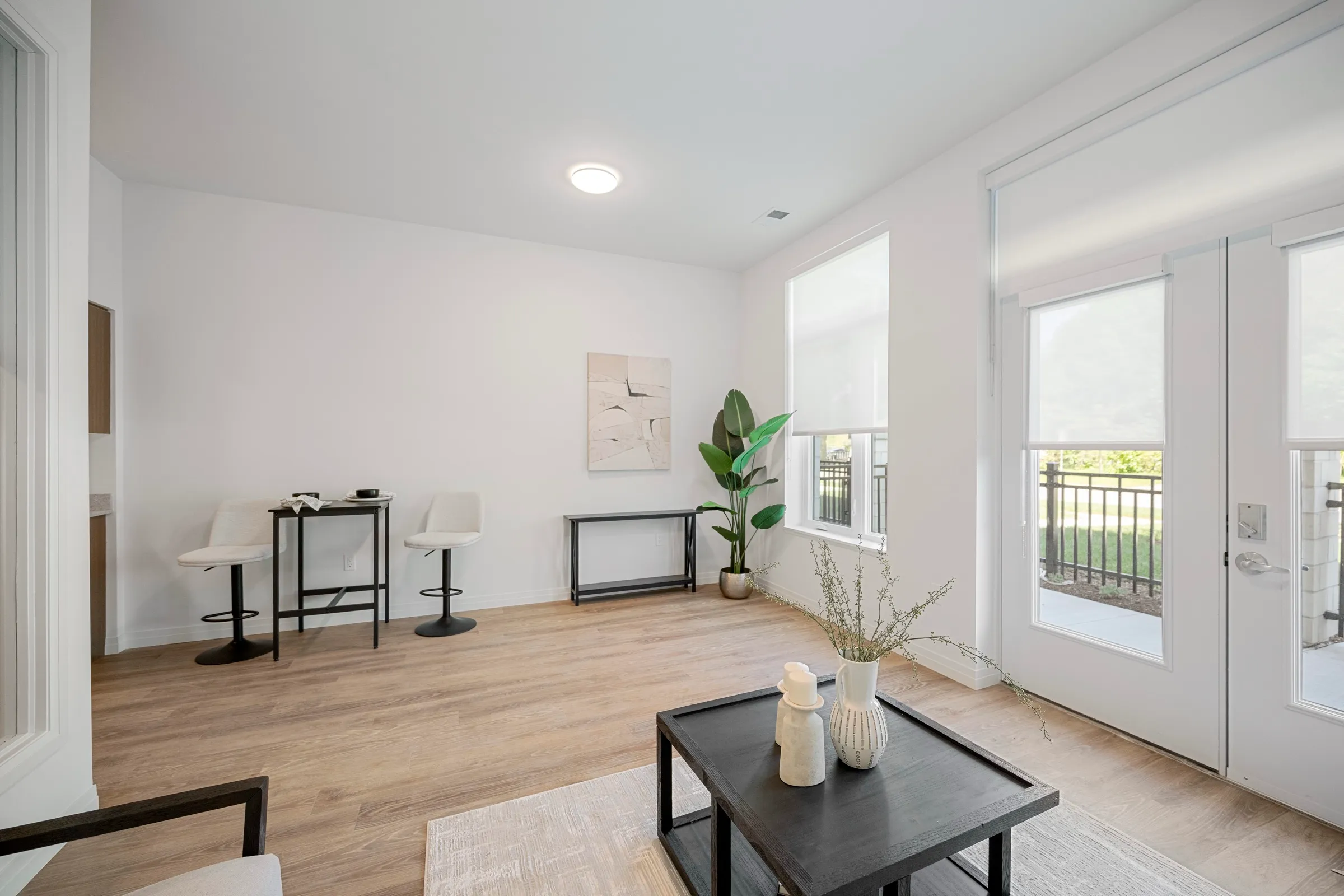 Open living and dining space with a patio door and low furniture