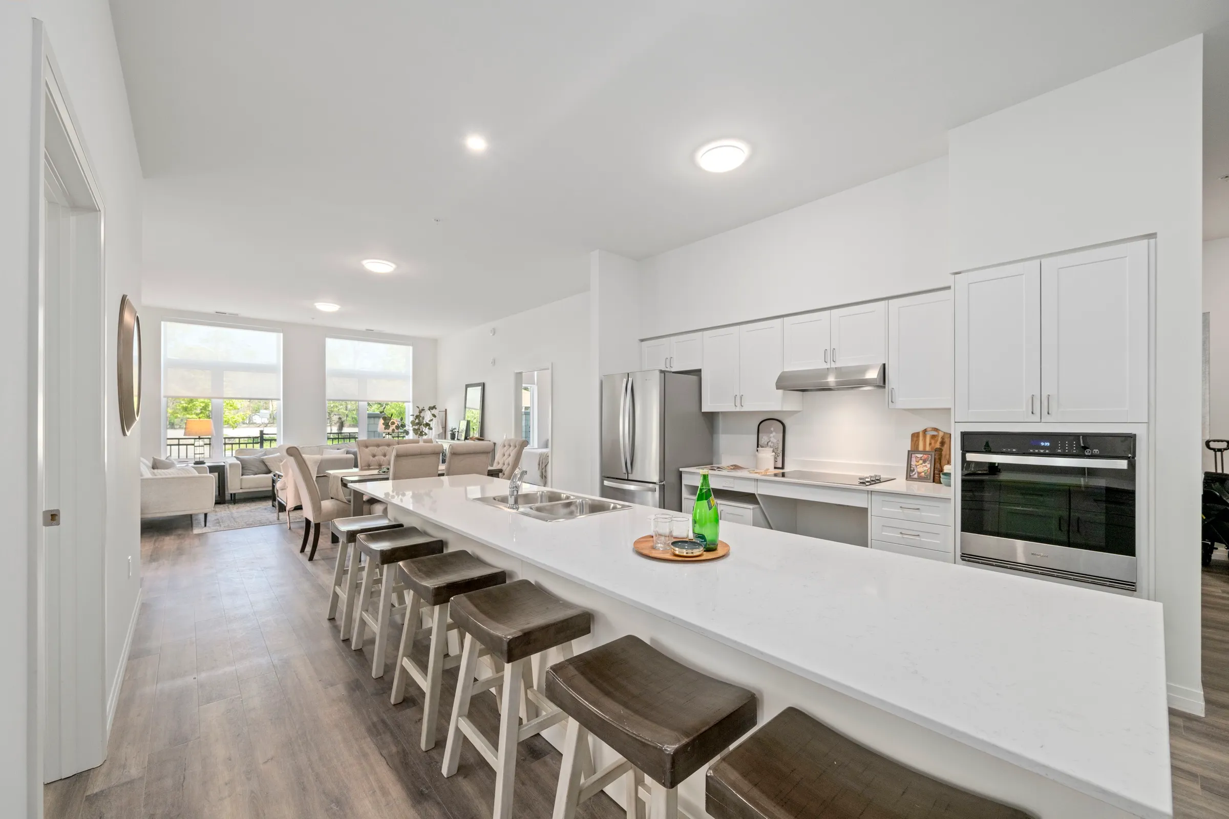 Open plan living and dining area with the kitchen along the back wall